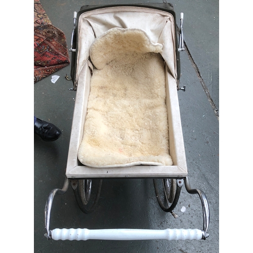 1064 - A vintage Silver Cross dolls pram, with a mattress and Christ lambswool child's seat cover