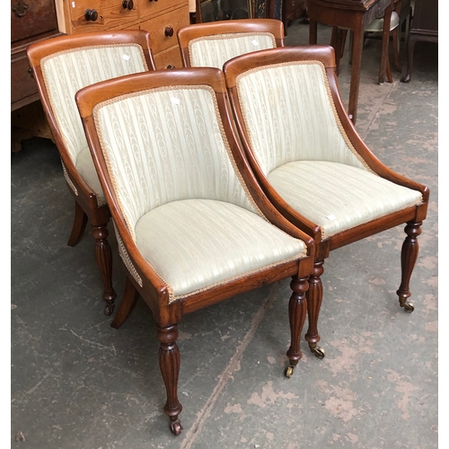 999 - A set of four Empire style rosewood side chairs, upholstered back and seat on fluted tapering legs a... 