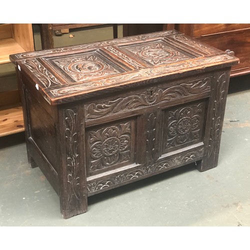 1009 - An 18th century and later two panel oak coffer, with candle box, 81x47x53cmH