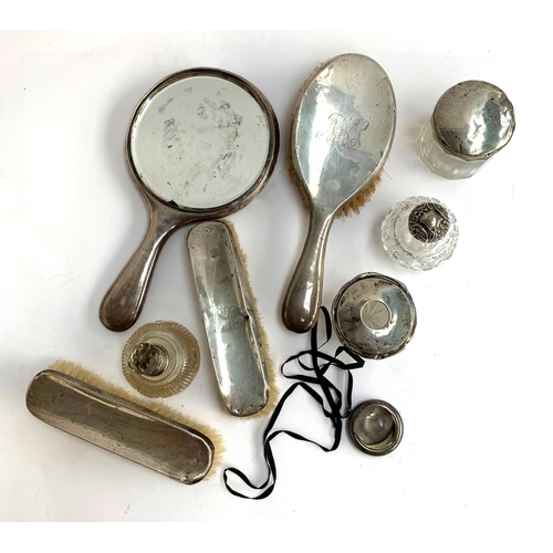 79 - A lot of silver and cut glass dressing table items, to include a pair of clothes brushes, hair brush... 