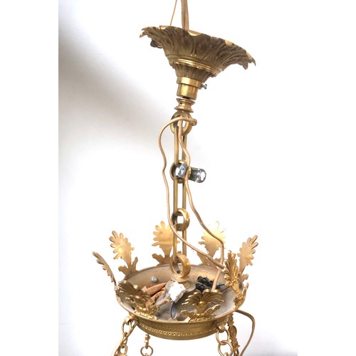 1062 - An eight arm gilt metal chandelier, each fitting on a swan form candle style sconce, with tole ware ... 