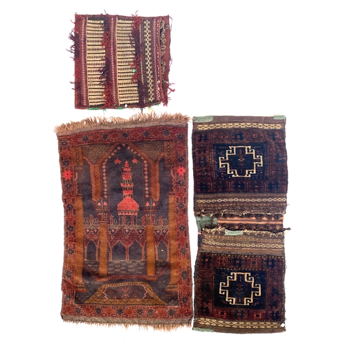 709 - A west Afghan 'mosque' prayer rug, mid 20th century, 109x70cm; together with two saddle bags, one wi... 