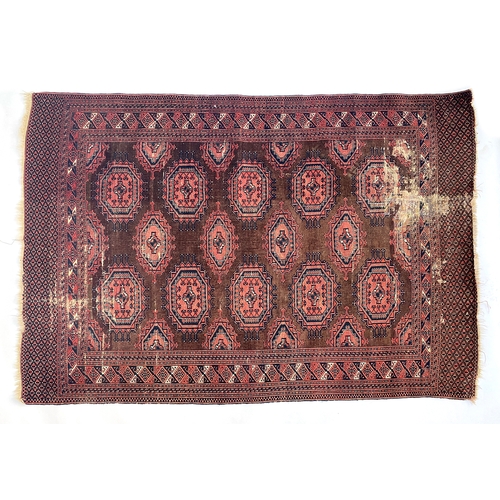 711 - A red ground Tekke rug (some wear), 201x136cm