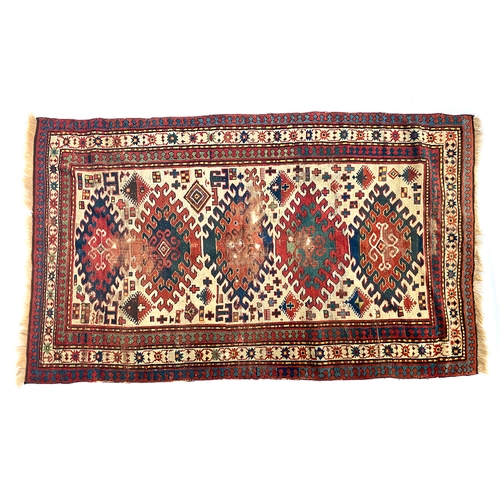 712 - A Persian Yalameh rug, triple border and five colourful serrated lozenges, 213x125cm