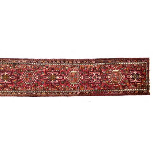 717 - A very long Gharadjeh runner rug, 480x76cm