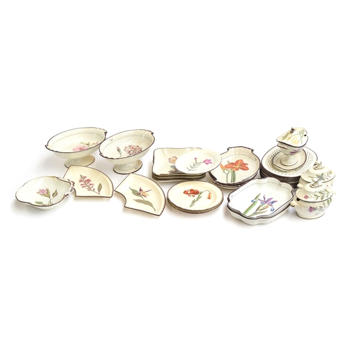 229 - A Davenport pearlware botanical dessert service, each piece hand painted with a flower within brown ... 