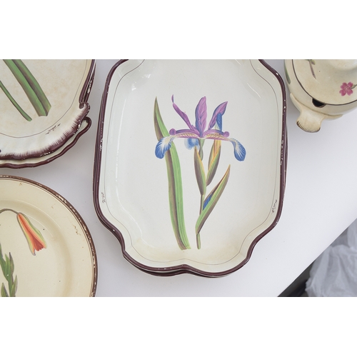 229 - A Davenport pearlware botanical dessert service, each piece hand painted with a flower within brown ... 