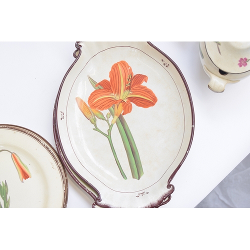 229 - A Davenport pearlware botanical dessert service, each piece hand painted with a flower within brown ... 