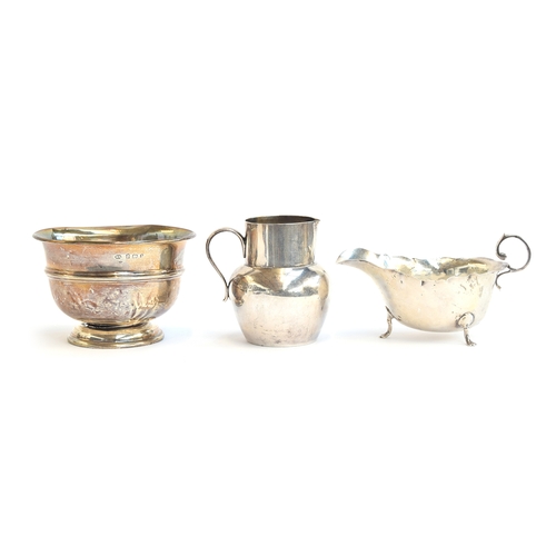 100 - A small silver cream jug, London 1919; a George V sauce boat; and a polo club trophy rose bowl, 8.8o... 