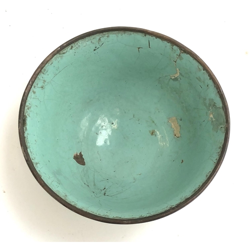 262 - A Chinese canton enamel bowl (af), flowers on a green ground, 11cmD