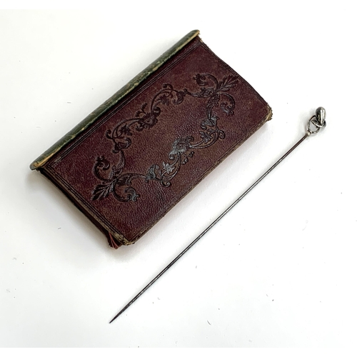 244 - An early 20th century Charles Horner silver hat pin; together with a leather cased set of bone handl... 