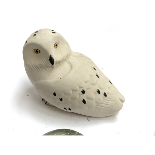 149 - A mixed lot of animal figurines to include Isle of Arran snowy owl; USSR Lomonosov ermine; soapstone... 