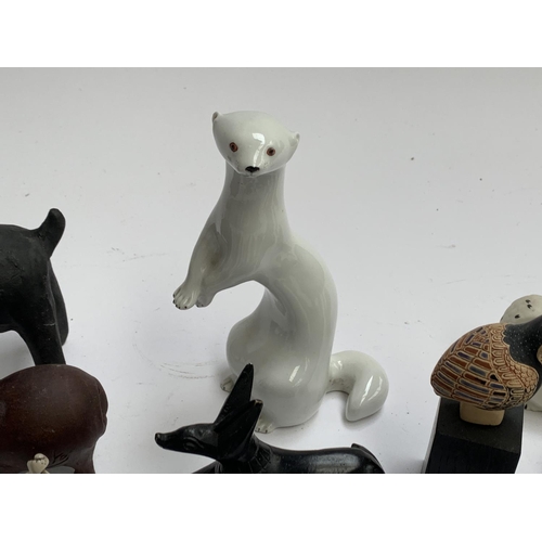 149 - A mixed lot of animal figurines to include Isle of Arran snowy owl; USSR Lomonosov ermine; soapstone... 