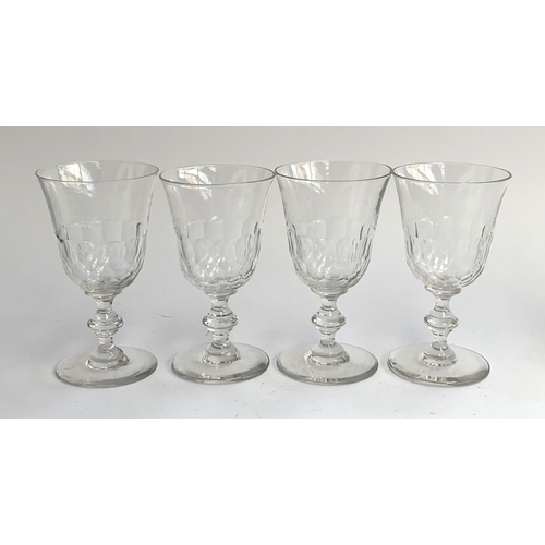 154 - A set of four hand blown cut glass wine glasses, with knopped stems, 15cmH