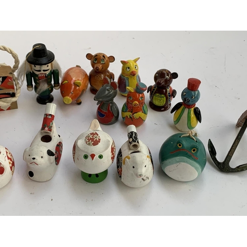 294 - Japanese ceramic zodiac whistles; ceramic bells; South American painted wooden figures inc. Mudherd ... 