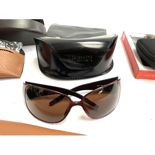 355 - A quantity of designer and other sunglasses, some with cases to include Burberry, Fendi, Michael Kor... 