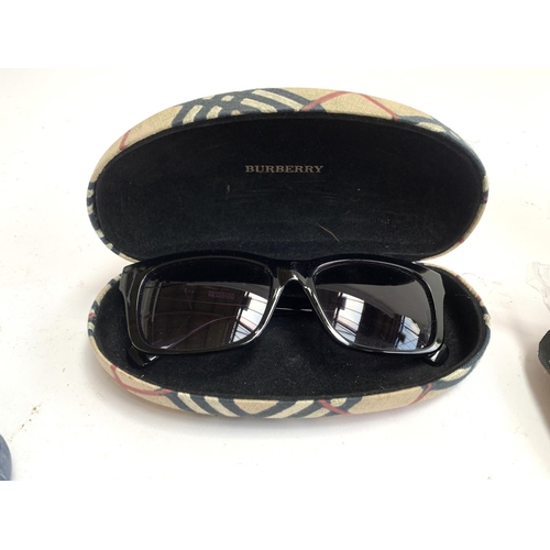 355 - A quantity of designer and other sunglasses, some with cases to include Burberry, Fendi, Michael Kor... 