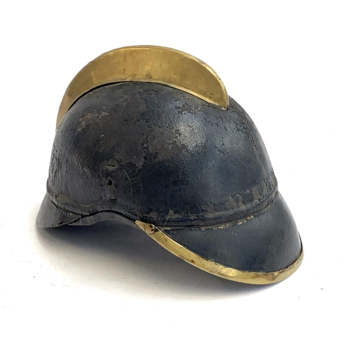 382 - A 19th century leather and brass firemans helmet