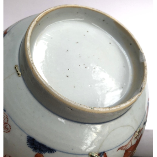 202 - A 19th century Chinese export bowl, with staple pairs, floral decoration in orange and blue, 23cmD