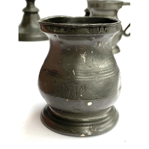 418 - A quantity of pewter, some with touchmarks, to include candlesticks 26cmH, large plate 35cmD, jug ma... 