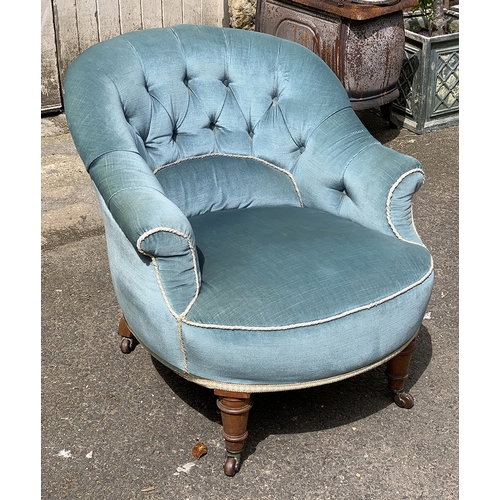 983 - A good Victorian buttonback bedroom chair, upholstered in blue fabric, on turned front legs and four... 