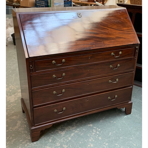 984 - A large early 19th century mahogany bureau, fall front over four graduating drawers, on bracket feet... 