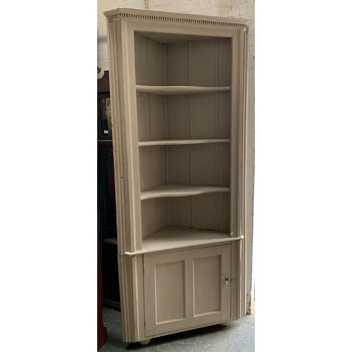 1013 - A tall grey painted pine standing corner cupboard, three shelves over a panelled door, 100cmW  226cm... 