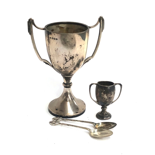 69 - A silver twin handled trophy cup, Birmingham 1938, 16.5cmH; together with one other miniature trophy... 