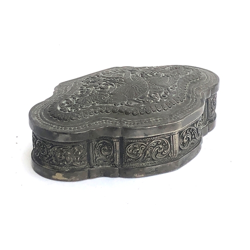 A probably Sri Lankan shaped white metal box, chased with two birds among foliage, 5.5ozt