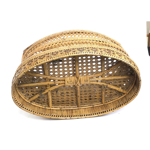 509 - A cane and bamboo basket with handle