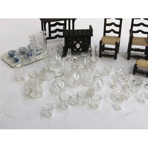 233 - A quantity of dolls house furniture to include hand blown glass dinner service; blue and white ceram... 