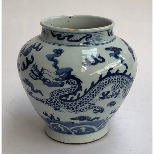 236 - A Chinese blue and white vase, decorated with a dragon amongst clouds, 18cmH