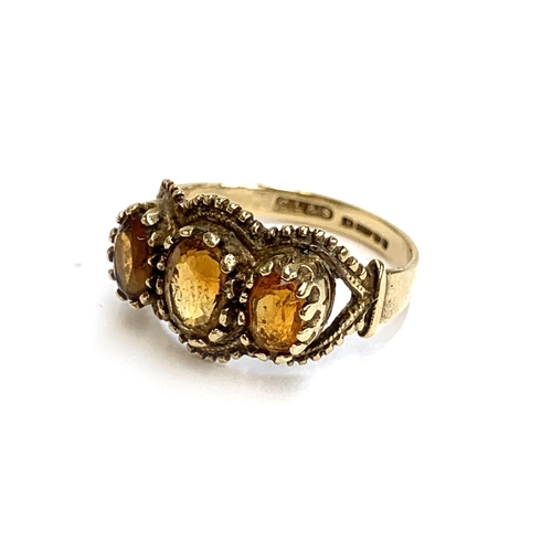 13 - A 9ct gold citrine trilogy ring, size N, 3.1g