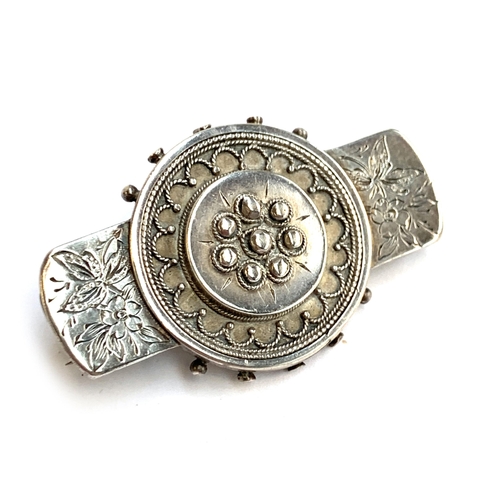 30 - A Victorian silver Etruscan revival brooch, 4.5cmW; together with a silver chain with dogclip, 8.3g