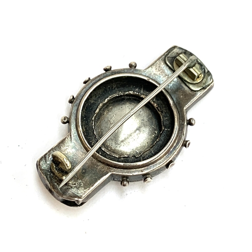 30 - A Victorian silver Etruscan revival brooch, 4.5cmW; together with a silver chain with dogclip, 8.3g