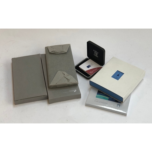 251 - Concorde interest: two boxed notepads, new in wrapping; a Concorde calendar diary for 2003; desk sta... 