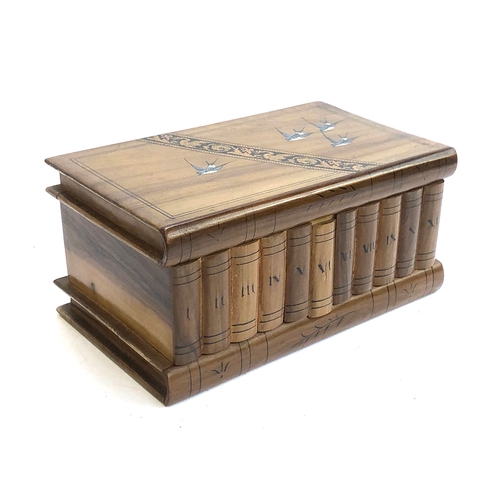 252 - A Sorrento ware puzzle box, modelled as a shelf of books, 23cm wide