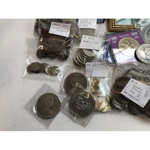 58 - COINS etc. A small quantity of pre 1947 silver coins, a framed ten shilling note; 50 pence pieces (i... 