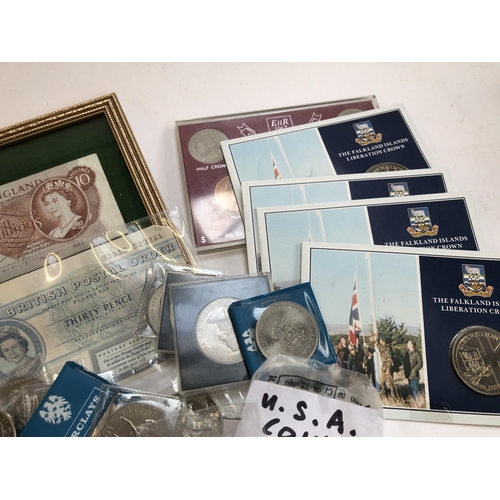 58 - COINS etc. A small quantity of pre 1947 silver coins, a framed ten shilling note; 50 pence pieces (i... 