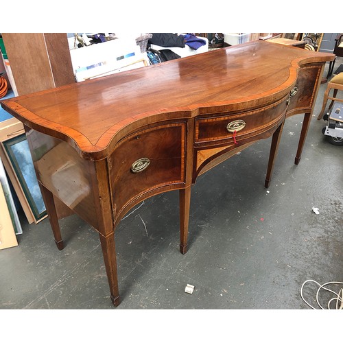 1029 - A substantial Georgian revival mahogany crossbanded serpentine sideboard, central drawer with well b... 