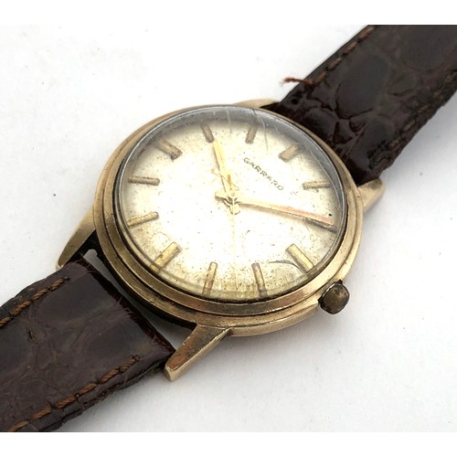 89 - A Garrard 9ct gold gent's wrist watch, c.1970, silvered dial with baton markers, Swiss 17 jewel manu... 