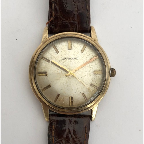 89 - A Garrard 9ct gold gent's wrist watch, c.1970, silvered dial with baton markers, Swiss 17 jewel manu... 