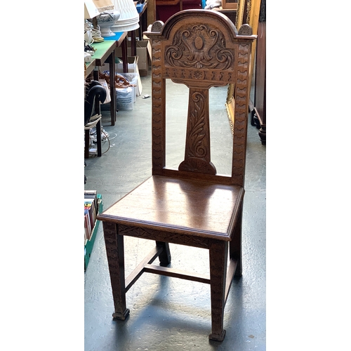 1039 - A carved oak side chair, together with a small Chinese side table with carved glass inset top