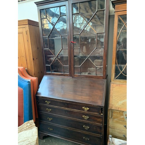 1032 - A 19th century glazed bureau bookcase, adjustable shelves, fall front over four graduating drawers, ... 