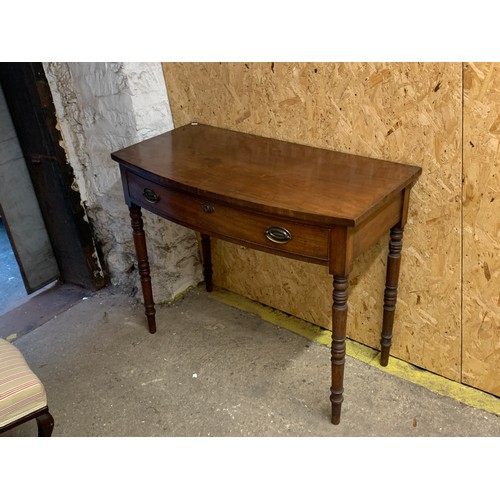 1038 - A Regency mahogany bowfront side table, with single drawer, on turned tapering legs, 99x51x79cm