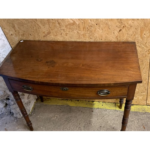 1038 - A Regency mahogany bowfront side table, with single drawer, on turned tapering legs, 99x51x79cm