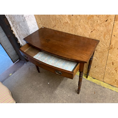 1038 - A Regency mahogany bowfront side table, with single drawer, on turned tapering legs, 99x51x79cm