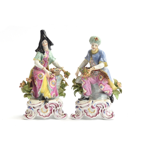 217 - A pair of French 19th century porcelain figures of a couple in Ottoman dress, probably Samson, each ... 