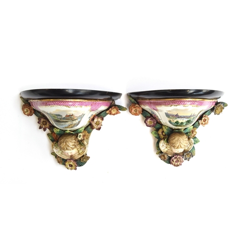 215 - A pair of Meissen style wall brackets, with putti and floral encrusted detail, hand painted continen... 