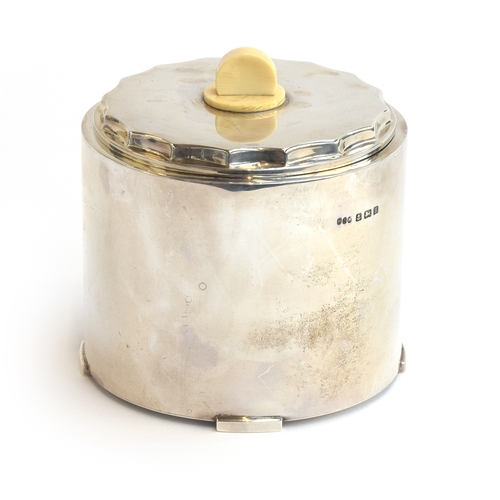 115 - An Art Deco silver biscuit barrel by Hukin & Heath Ltd, Birmingham 1932, of cylindrical form on four... 